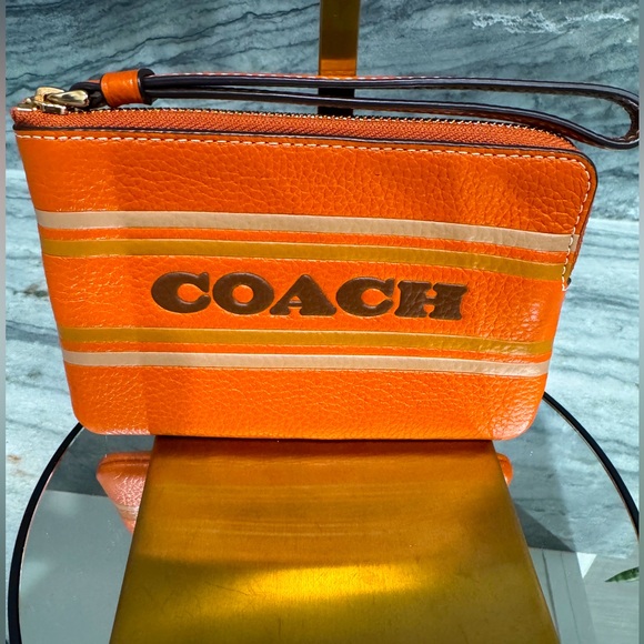 Coach Handbags - COACH Corner Zip Wristlet With Coach Stripe
